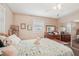 Comfortable bedroom with a queen bed and mirrored closet doors at 708 Rutgers Pl, Sun City Center, FL 33573