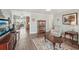 Comfortable living room featuring wood-look floors and an open floor plan at 708 Rutgers Pl, Sun City Center, FL 33573