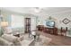Inviting living room featuring neutral decor, wood-look floors, and ample seating at 708 Rutgers Pl, Sun City Center, FL 33573