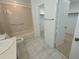 Bright bathroom with a shower-tub combination and a walk-in closet at 7125 Silvermill Dr, Tampa, FL 33635