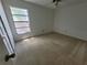 Bedroom featuring a window offering natural light and views at 7125 Silvermill Dr, Tampa, FL 33635