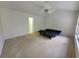 Bedroom featuring window, ceiling fan and doorway to other room at 7125 Silvermill Dr, Tampa, FL 33635