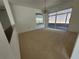 Carpeted dining area with chandelier and sliding door at 7125 Silvermill Dr, Tampa, FL 33635