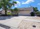 Charming single-story home with a well-maintained lawn, mature trees, and a spacious two-car garage at 7125 Silvermill Dr, Tampa, FL 33635