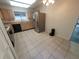 Kitchen with stainless steel refrigerator, tile floors, and a practical layout for cooking at 7125 Silvermill Dr, Tampa, FL 33635