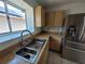 Kitchen showcasing stainless steel appliances and laminated countertops at 7125 Silvermill Dr, Tampa, FL 33635