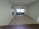 Bright living room with carpet floor and sliding glass doors at 7125 Silvermill Dr, Tampa, FL 33635