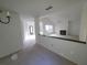 Open living room featuring a fireplace and plenty of natural light at 7125 Silvermill Dr, Tampa, FL 33635