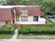 Aerial view of townhouse featuring fenced in back patio and a balcony at 739 1St Ct, Palm Harbor, FL 34684