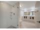 Modern bathroom featuring a glass-enclosed shower with stylish tile and double vanity at 739 1St Ct, Palm Harbor, FL 34684