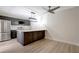 Spacious kitchen with a large island, stainless steel appliances, and contemporary pendant lighting at 739 1St Ct, Palm Harbor, FL 34684