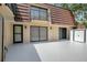 Back patio with room for outdoor activities, balcony and storage shed at 739 1St Ct, Palm Harbor, FL 34684