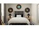 Stylish bedroom with vinyl record décor above the bed and abstract floor design at 7541 E 116Th St, Palmetto, FL 34221