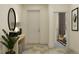 Inviting hallway with stylish decor, including a decorative mirror and a glimpse of the bedroom at 7541 E 116Th St, Palmetto, FL 34221