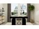Bright home office featuring a modern desk, stylish shelving, and a large window with a view at 7541 E 116Th St, Palmetto, FL 34221
