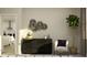 Stylish living area with a dark wood dresser, decor accents, and doorway to a living area at 7541 E 116Th St, Palmetto, FL 34221