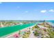 Beautiful waterfront views with tennis courts in this sunny aerial shot at 7600 Bayshore Dr # 1201A, Treasure Island, FL 33706