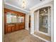 Luxurious bathroom with a double sink vanity, a large mirror, and a walk-in shower with glass enclosure at 7600 Bayshore Dr # 1201A, Treasure Island, FL 33706