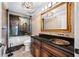 Elegant bathroom features a tub, shower, granite counters, and decorative brown wallpaper at 7600 Bayshore Dr # 1201A, Treasure Island, FL 33706