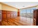 Bright bedroom featuring custom wood paneling, shelving, and expansive windows with ocean views at 7600 Bayshore Dr # 1201A, Treasure Island, FL 33706