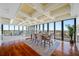 Open-concept dining area features ocean views, elegant coffered ceilings, and seamless flow to the living space at 7600 Bayshore Dr # 1201A, Treasure Island, FL 33706