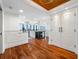 Bright condo entryway featuring hardwood floors leading into a gourmet kitchen and living area with floor to ceiling windows at 7600 Bayshore Dr # 1201A, Treasure Island, FL 33706