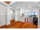 Hallway features hardwood floors and access to a well-appointed kitchen and other living areas at 7600 Bayshore Dr # 1201A, Treasure Island, FL 33706
