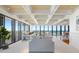Bright and airy living room with panoramic ocean views, coffered ceilings, and white sofas at 7600 Bayshore Dr # 1201A, Treasure Island, FL 33706
