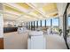 Bright living room features elegant coffered ceilings and floor-to-ceiling windows with breathtaking city views at 7600 Bayshore Dr # 1201A, Treasure Island, FL 33706