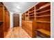 Spacious walk-in closet featuring custom shelving, drawers, and ample storage to accommodate any wardrobe at 7600 Bayshore Dr # 1201A, Treasure Island, FL 33706