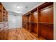 Well-organized walk-in closet with built-in shelves, hanging rods, and drawers to maximize storage potential at 7600 Bayshore Dr # 1201A, Treasure Island, FL 33706