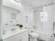 Bright bathroom features a tub/shower, white vanity, and patterned tile floor at 8059 26Th N Ave, St Petersburg, FL 33710