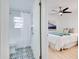 Well-lit bathroom with patterned tile flooring, shower/tub, and is adjacent to the bedroom at 8059 26Th N Ave, St Petersburg, FL 33710