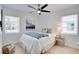 Cozy bedroom with natural light, fan, and calm decor creates a relaxing atmosphere at 8059 26Th N Ave, St Petersburg, FL 33710