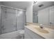 Bathroom features a shower and tub combo with sliding glass doors and tile flooring at 865 S Gulfview Blvd # 202, Clearwater Beach, FL 33767