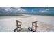 Direct beach access from the community with stairs leading down to the white sand at 865 S Gulfview Blvd # 202, Clearwater Beach, FL 33767