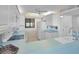 Bright kitchen with white appliances, cabinets, and vintage beach condo character at 865 S Gulfview Blvd # 202, Clearwater Beach, FL 33767