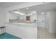 Bright and modern kitchen with breakfast bar offering plenty of counter space and natural light at 865 S Gulfview Blvd # 202, Clearwater Beach, FL 33767