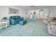 Comfortable living area offering a view of the adjacent dining space and fully equipped kitchen at 865 S Gulfview Blvd # 202, Clearwater Beach, FL 33767