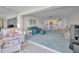 Spacious living room with beach view, comfortable seating area, and seamless access to the dining space at 865 S Gulfview Blvd # 202, Clearwater Beach, FL 33767