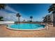Enjoy this community pool with beach views, palm trees and plenty of lounge seating at 865 S Gulfview Blvd # 202, Clearwater Beach, FL 33767