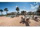 Enjoy the outdoor pool area with dining and lounge seating, perfect for entertaining at 865 S Gulfview Blvd # 202, Clearwater Beach, FL 33767