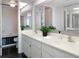 Spacious bathroom with double sinks, modern fixtures, and a separate shower and tub at 9000 Commodore Dr # 606, Seminole, FL 33776