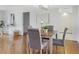 Dining room with seating for four and hardwood floors, great for entertaining guests at 9000 Commodore Dr # 606, Seminole, FL 33776