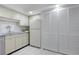 Efficient kitchen layout with ample cabinets, stainless-steel dishwasher, and a standard-size refrigerator at 9000 Commodore Dr # 606, Seminole, FL 33776