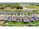 Primary-planned community with modern homes, lakes, and roads winding through the landscape at 9293 Rally Spring Loop, Wesley Chapel, FL 33545