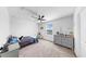 Bright bedroom featuring a ceiling fan, window and carpeted flooring at 9293 Rally Spring Loop, Wesley Chapel, FL 33545