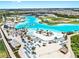 Aerial view of a stunning crystal lagoon with beaches and a waterpark surrounded by the community at 9293 Rally Spring Loop, Wesley Chapel, FL 33545