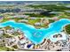 Community lagoon featuring watersports, sandy beaches, and modern residences offering a resort-style living experience at 9293 Rally Spring Loop, Wesley Chapel, FL 33545