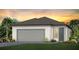 Inviting single-Gathering home featuring a two-car garage, neutral paint, and a well-maintained lawn in a desirable community at 9515 Coastline Way, Parrish, FL 34219